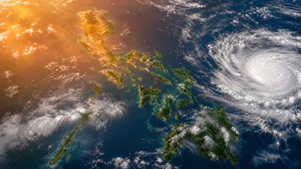 Weather illustration showing storm clouds east of Mindanao and rain over parts of the Philippines